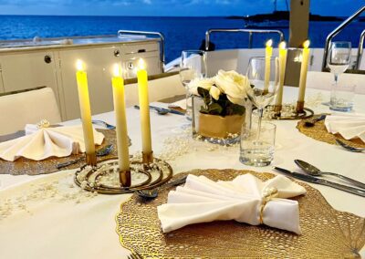 Elegant dining table by the sea at dusk.