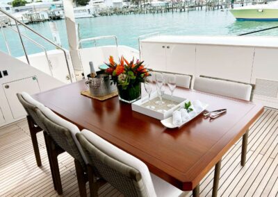 Elegant table setup with drinks and flowers.