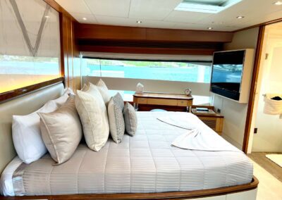 Elegant yacht bedroom with ocean view.