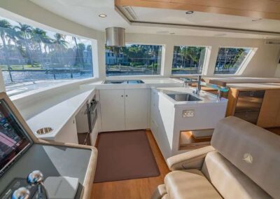 Modern boat interior with large windows.