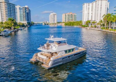 Luxury yacht navigating a serene waterway.