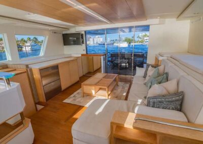 Modern boat interior with large windows.