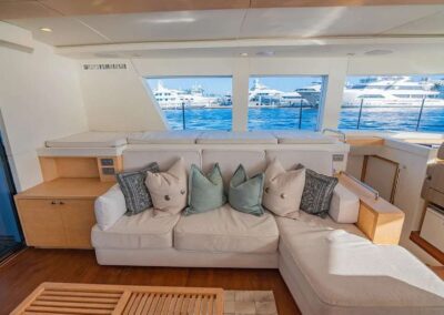 Luxurious yacht interior with comfortable seating.