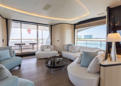 Luxurious yacht interior with comfortable seating.