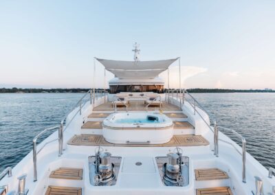 Luxury yacht deck with hot tub view.