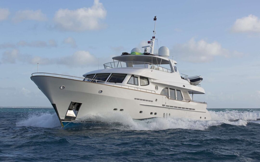 Luxury yacht sailing on calm waters.