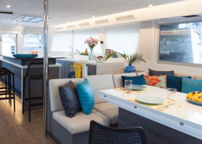 Modern boat interior with dining area.