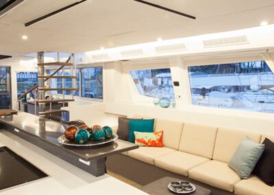 Modern yacht interior with cozy sitting area.