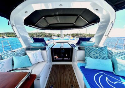 Luxury boat seating with turquoise cushions.