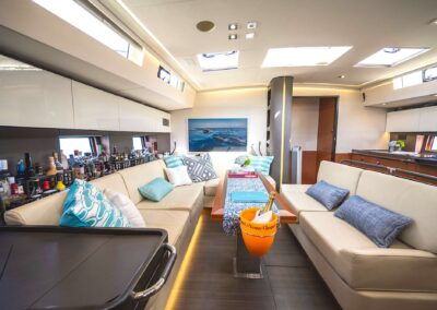 Luxurious yacht interior with seating and decor.