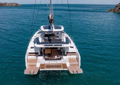 Sailing catamaran on tranquil blue waters.