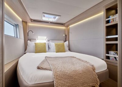 Cozy bedroom with yellow pillows and blankets.