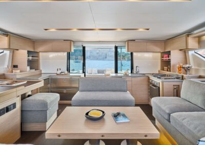 Modern yacht interior with open kitchen.